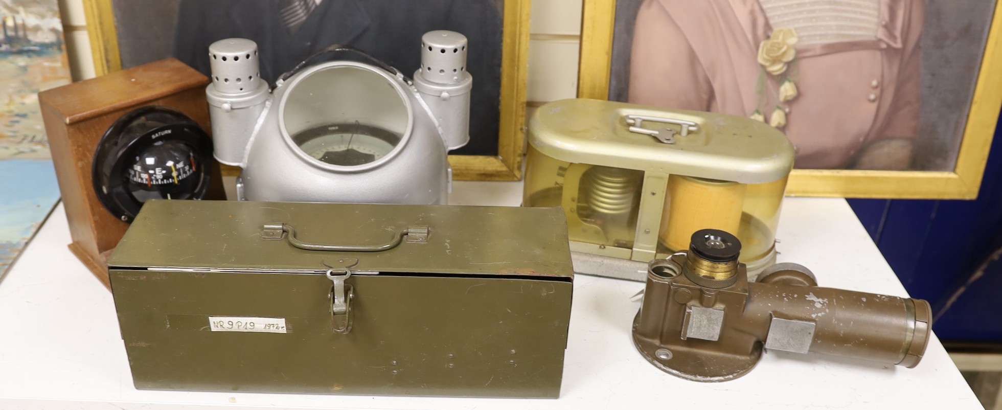 A World War Two gun-sight, ship's binnacle, barograph, etc.